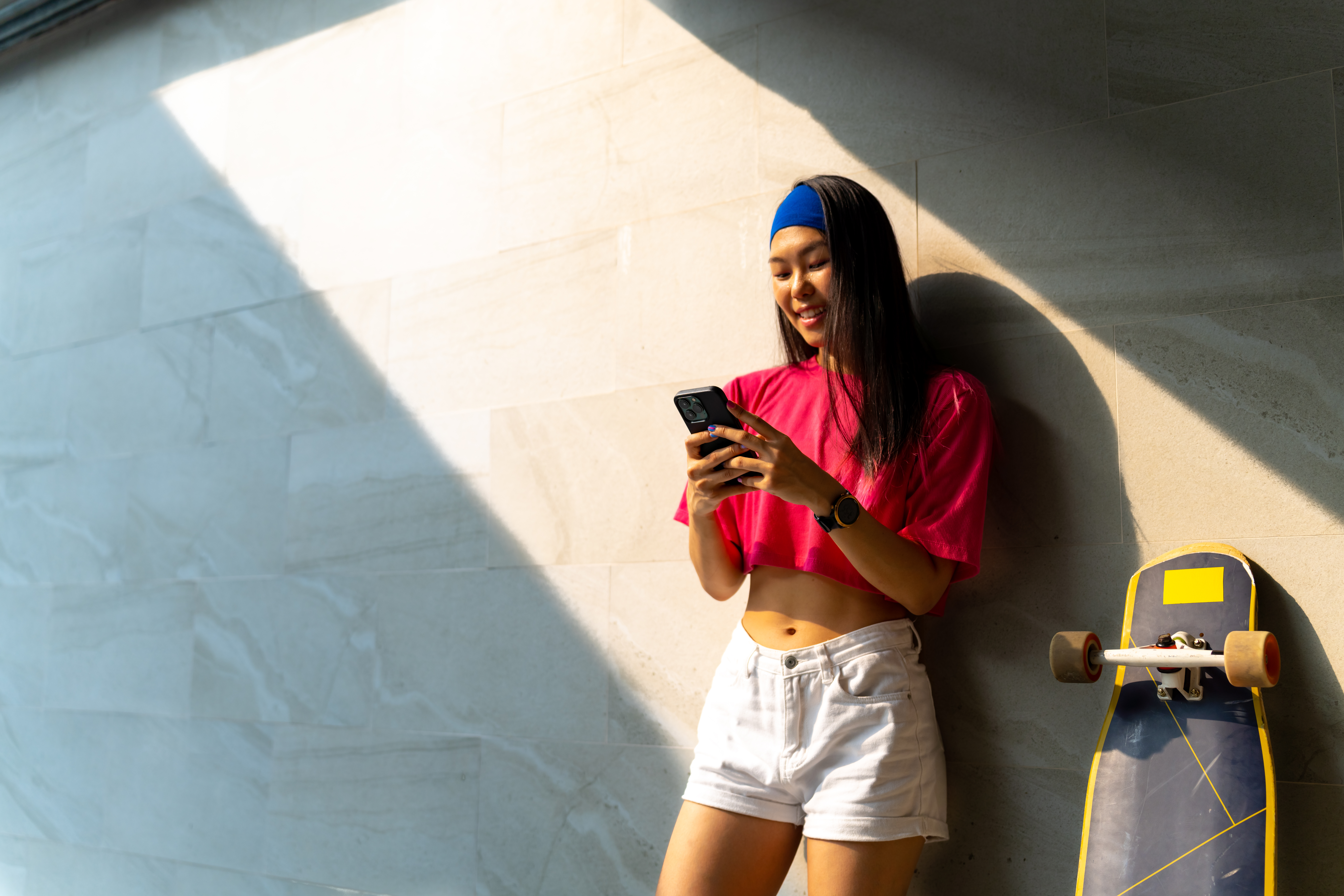 Young person on phone - The PHA Group