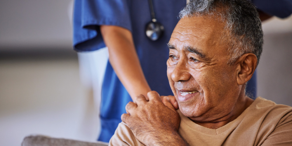 Older person with healthcare professional - The PHA Group