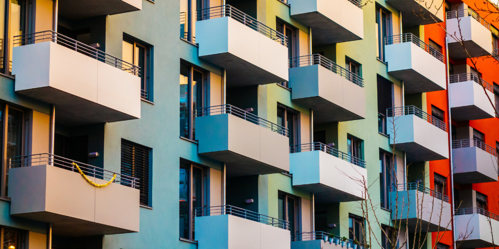 Balconies on colourful block of flats - The PHA Group