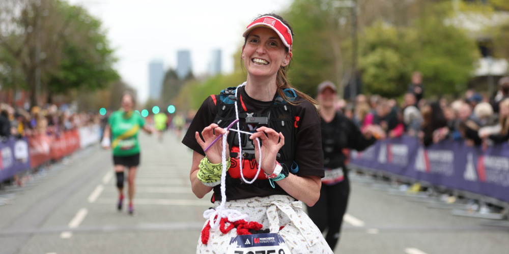 Woman running in mass participation marathon - The PHA Group