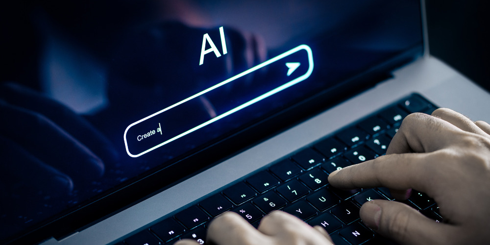 Person on laptop using AI search - The PHA Group