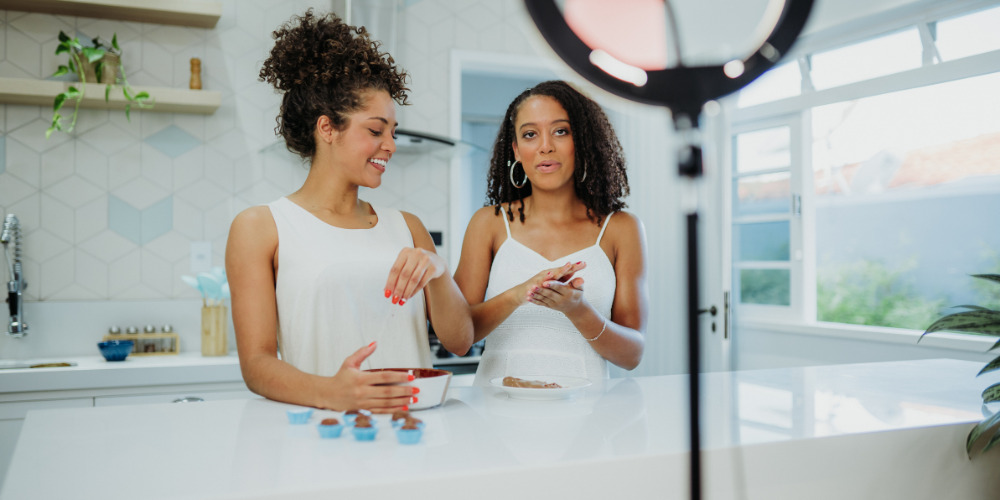 2 women filming a video launch their brand on TikTok - The PHA Group