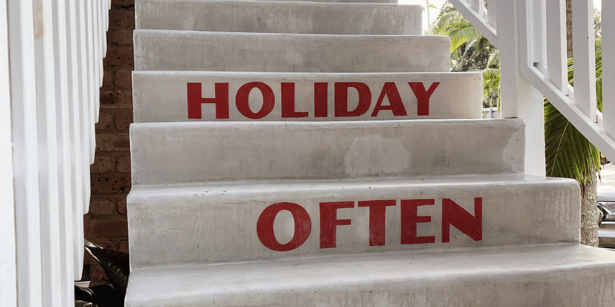 Set of white steps that say holiday often in red - The PHA Group